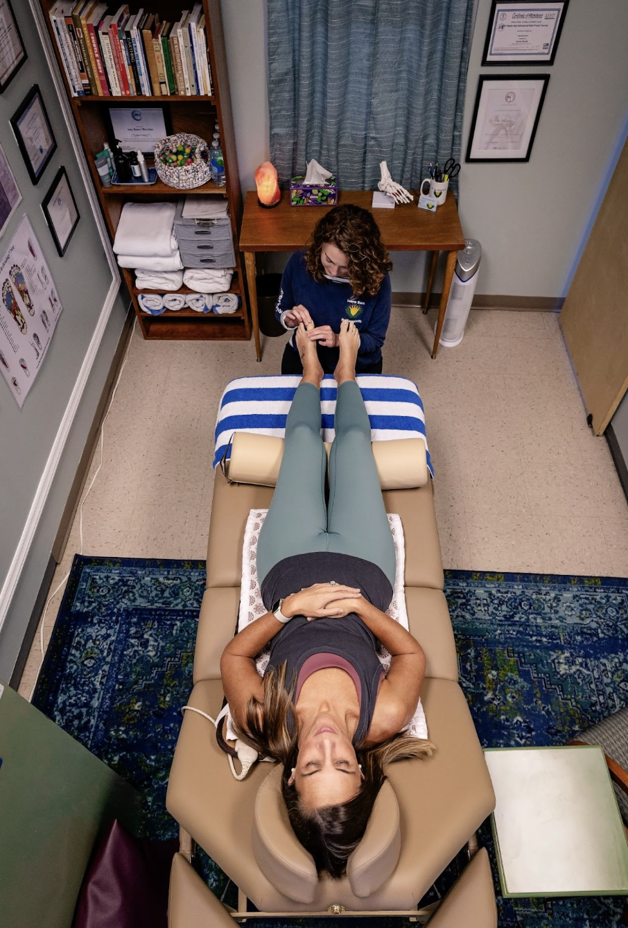 Amy Morrison performing a reflexology session in her Moneta studio